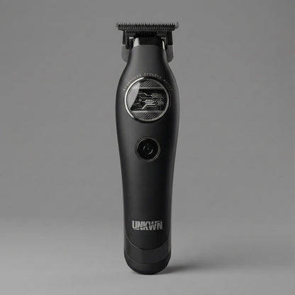 The UNKWN Vortex Cyclone Trimmer UNK1T standing upright, showing the brushless motor window and the power button