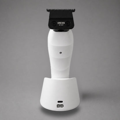 Rear view of the white UNKWN Vortex Cyclone Trimmer, showing the BT49T blade, rear indicator and charging dock ports