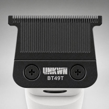 Close-up of the UNKWN Cyclone Trimmer T-blade in white, showing the BT49T zero-gap blade